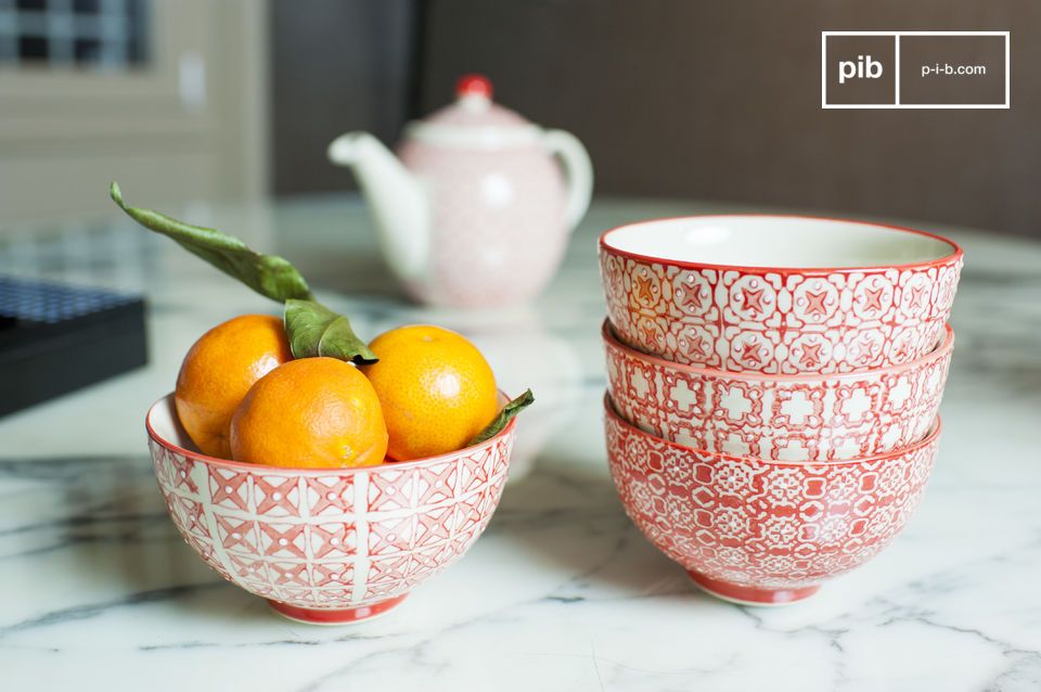 Four bowls with geometric patterns of a bright red.