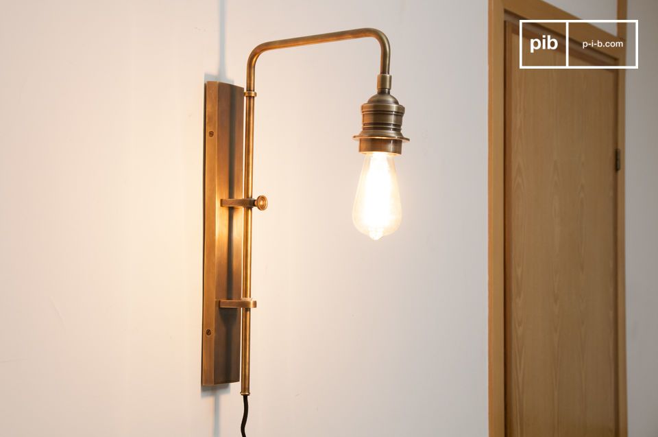 Wall lamp made of brass with retro charm.