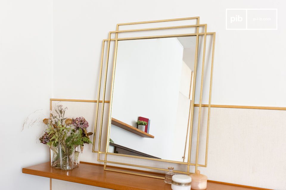 The large mirror is elegant and imposing.