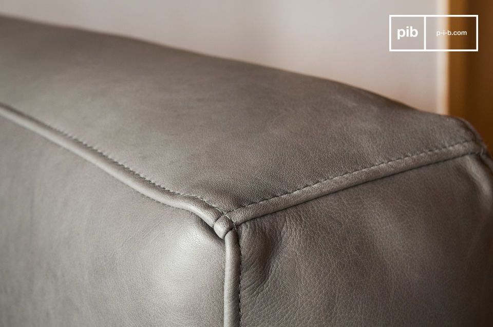 The grey is very slightly shaded and the leather is of a rare quality.