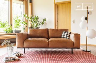 Almond sofa in brown leather