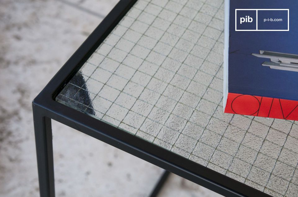 The glass and black structure provide a nice contrast to the table.