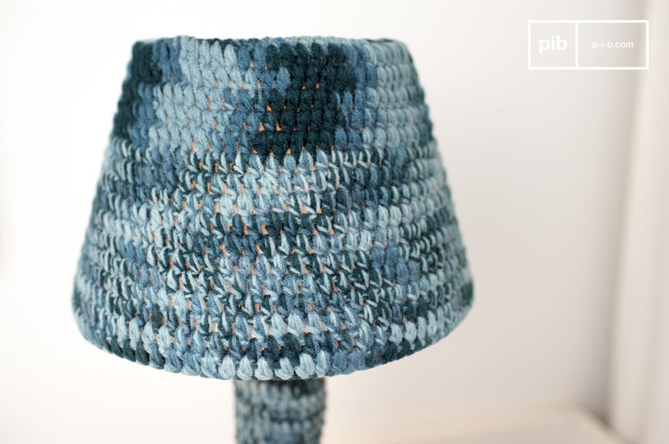 The lamp is entirely covered in hand-hooked textile.