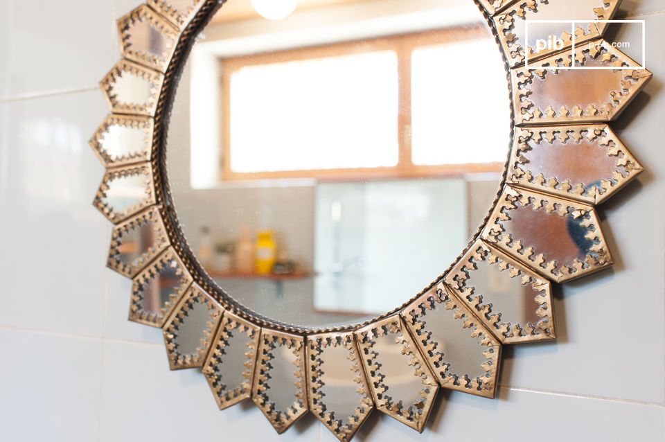 Charming and unusual brass sunglass mirror.