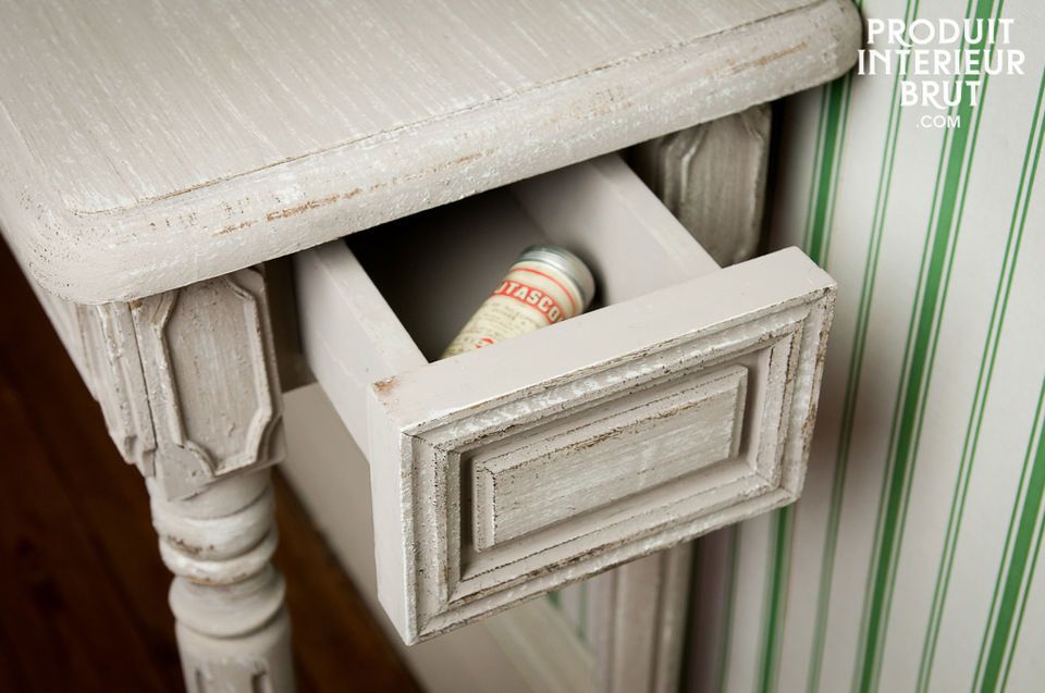 Well finished, this console has a grey patina paint applied to raw wood