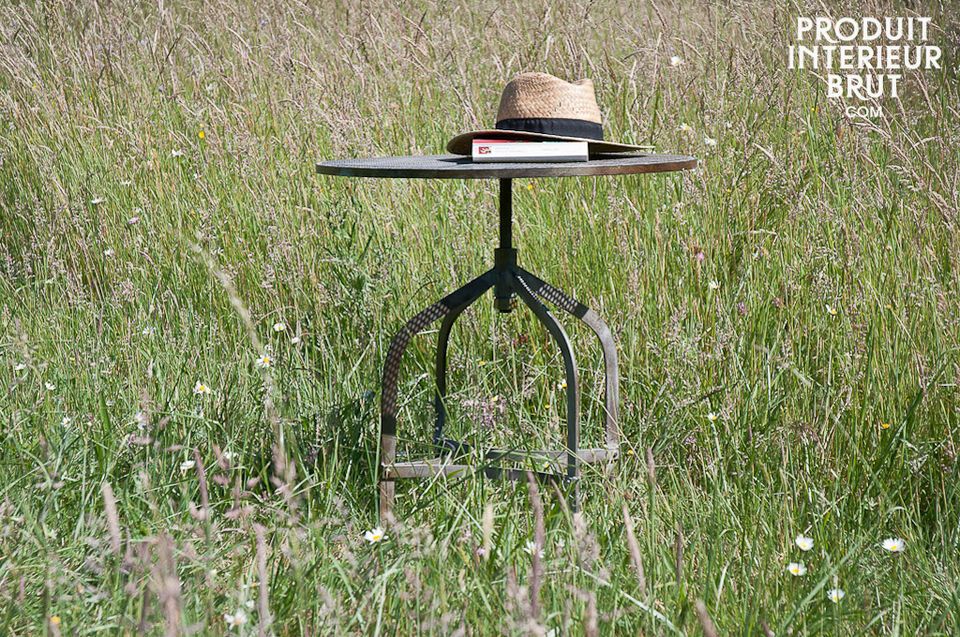 A very practical piece with a height adjustable circular top (54 to 74cm high)