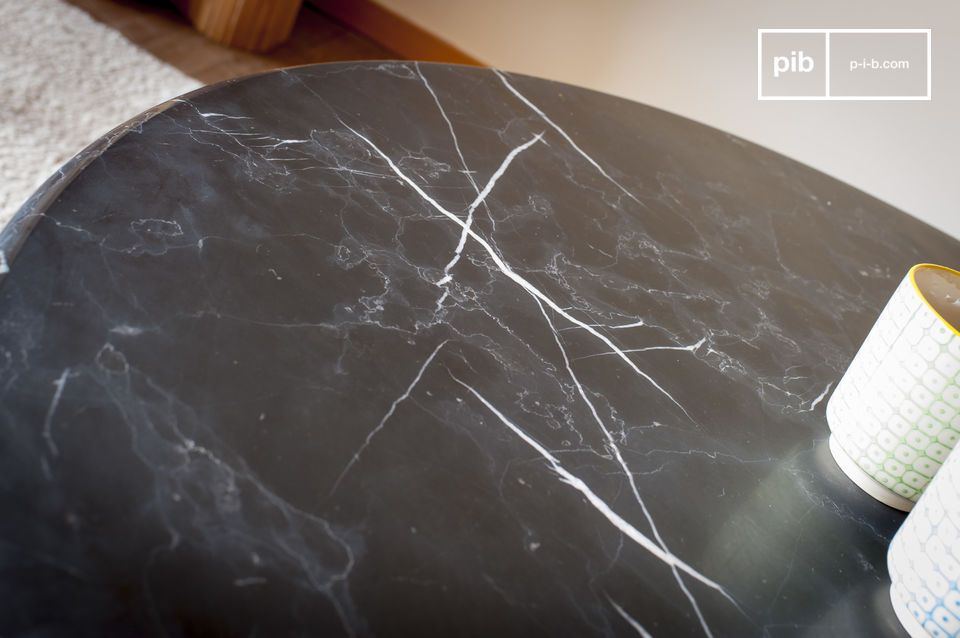 The marble top is a pretty black with a white veining.