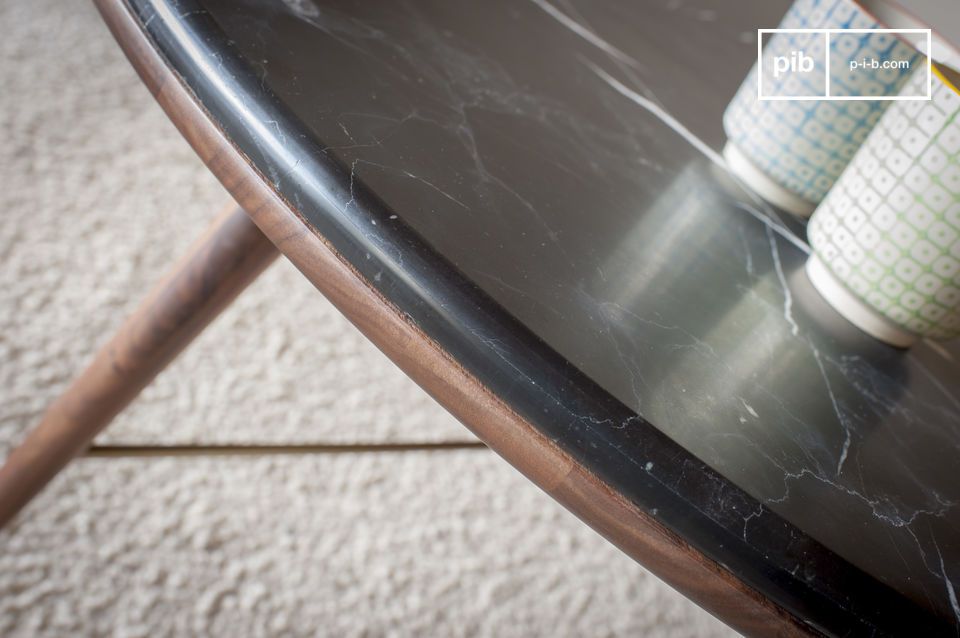 Black marble top on a walnut structure.