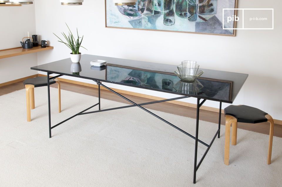 Large marble and metal table, elegant and refined.