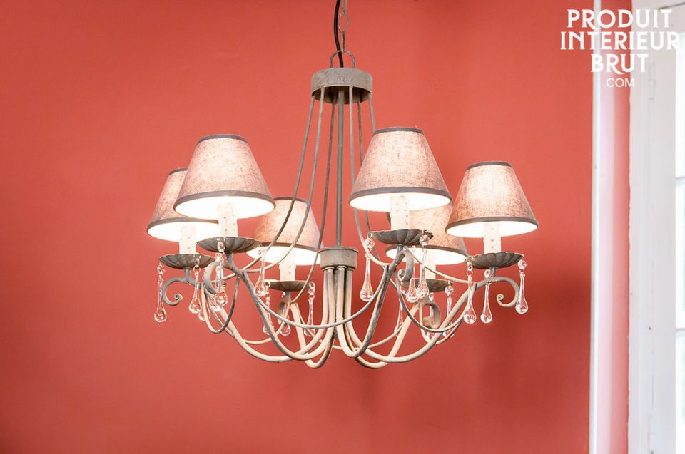 This chandelier mixes elegance and lightness with its curved lines and glass gobs which light up the