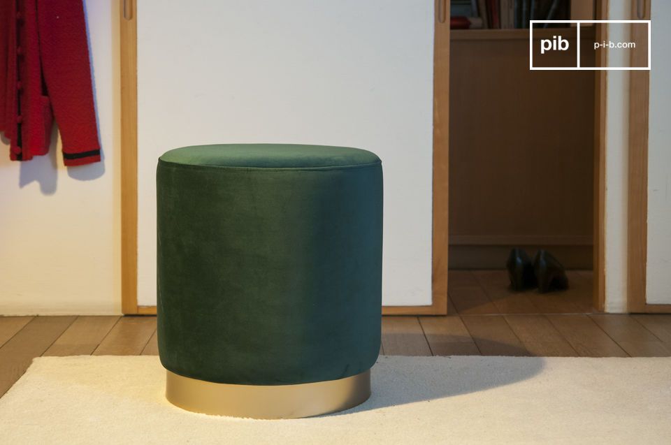 Deep green velvet pouf with a golden base.