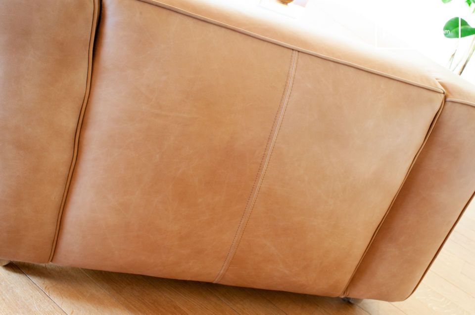 Hand-finished cowhide leather in a subtle moiré camel colour