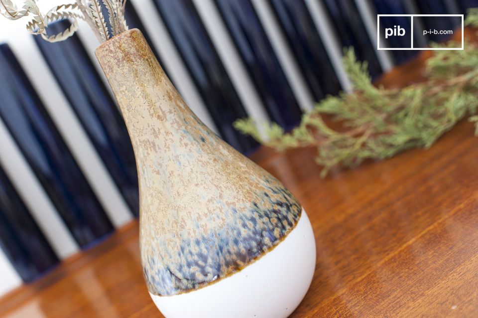 The vase has blue spots and a brown finish.