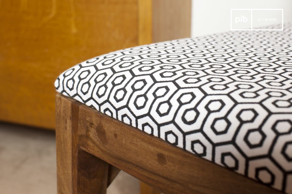 Enjoy its angular lines and the retro patterns of the fabric of the seat