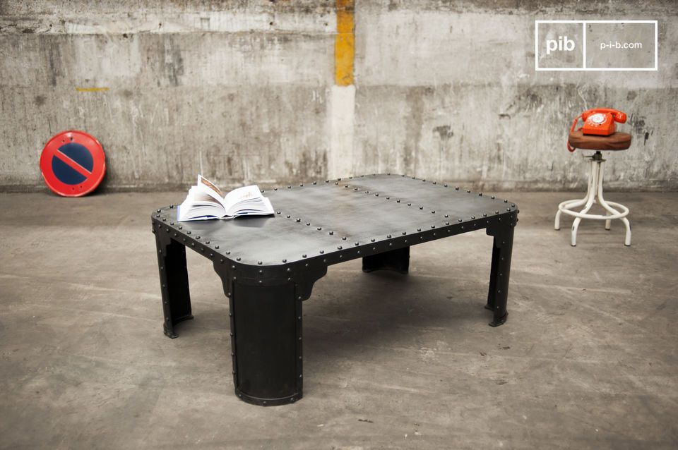 Beautiful dark steel coffee table with exposed rivets.
