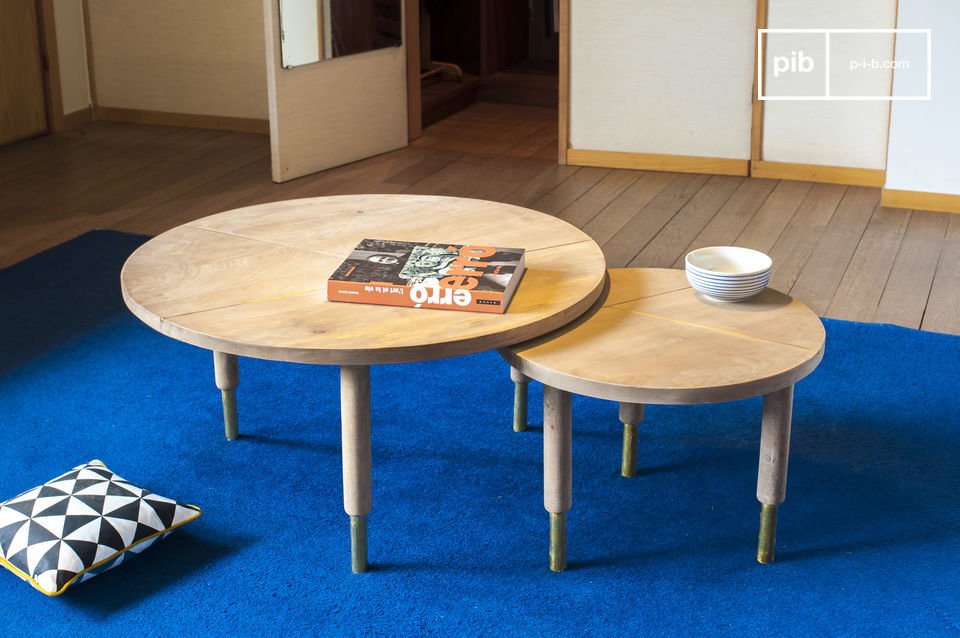 Nested tables combining light wood and golden touches.