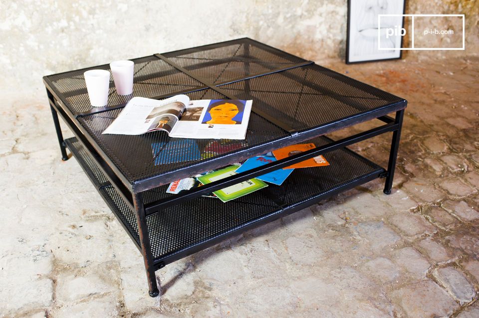 Coffee table made of slightly aged matt black metal.