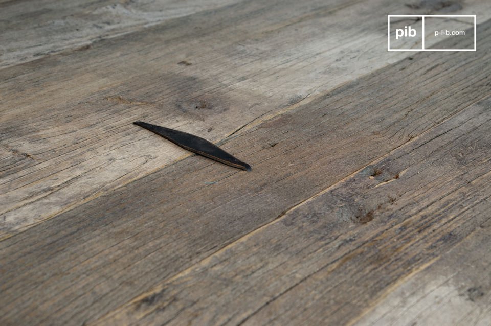 Metal rhombus on old elm wood planks.