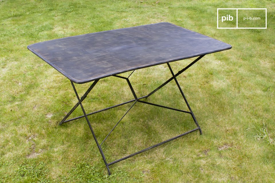 Choose this table which has definite retro cachet thanks to its layered paint distressed finish