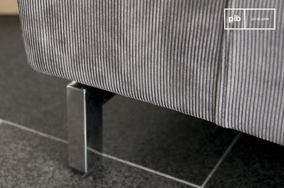 The sofa ends with an elegant metal base.