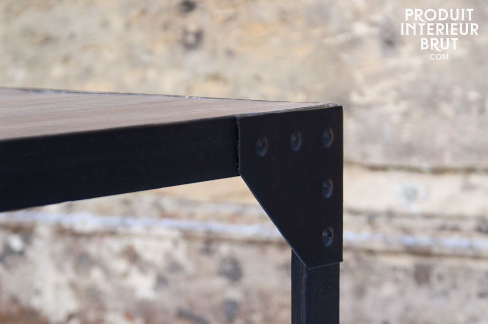 A small light wood table with a riveted mat black iron frame that makes this a sturdy piece of