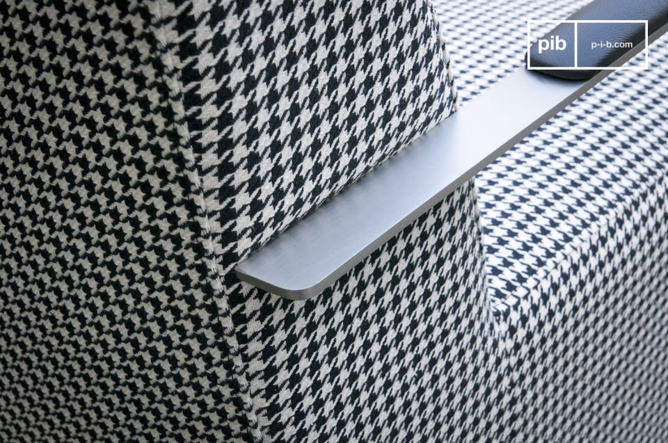 The chair has a pretty houndstooth design.