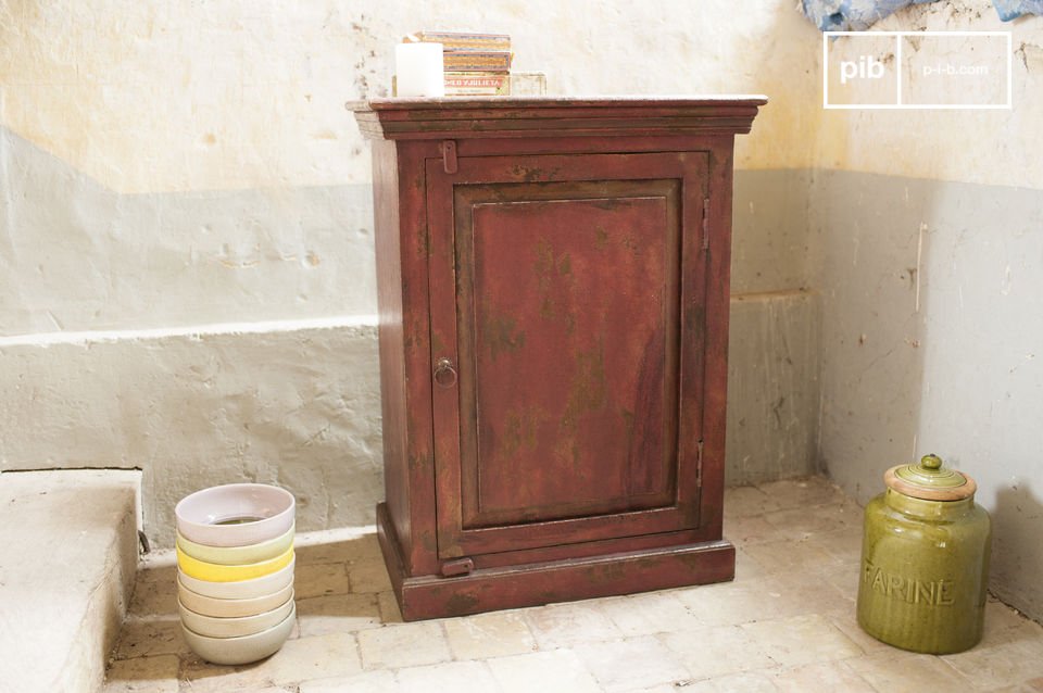 Solid mango wood cabinet covered with a delicate patina.