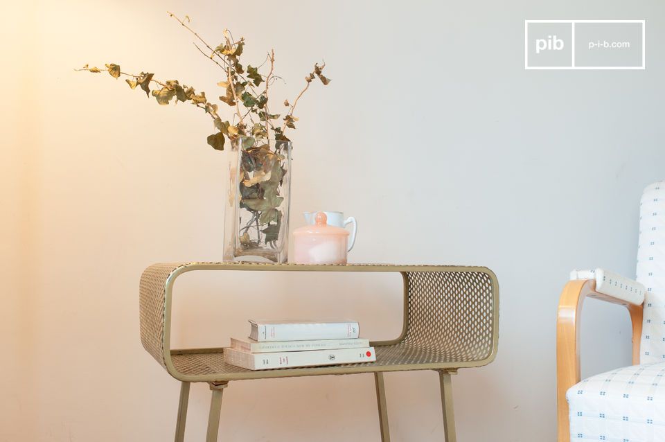 A radiant 70's inspired gilded punched metal side table