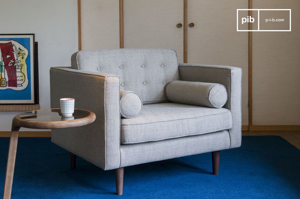 The sofa has pretty Scandinavian vintage lines.