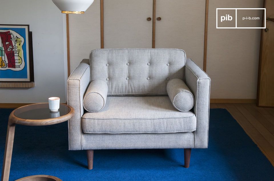 Elegant armchair in light grey mottled fabric with a vintage spirit.