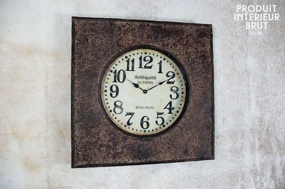 This metal clock has a fine textured and distressed finish