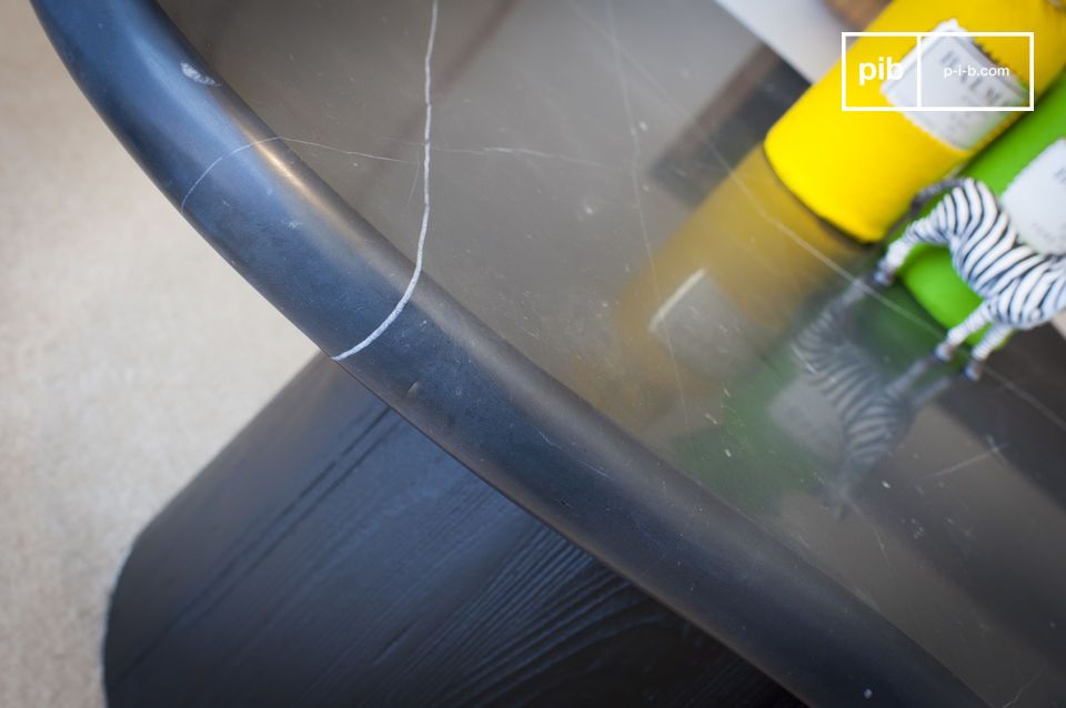 The thick marble and the quality of the wood make it a sturdy table.