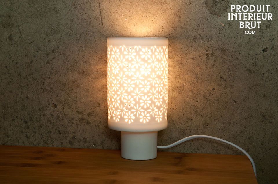 This Nordic design table lamp is completely white and made of translucid porcelain