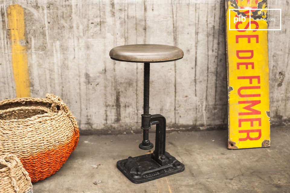 Beautiful stool with an industrial spirit made of cast iron and wood.
