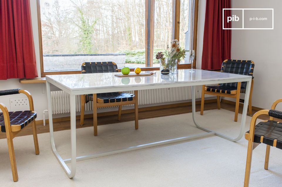 Beautiful dining table with a thick marble top in carrara style.