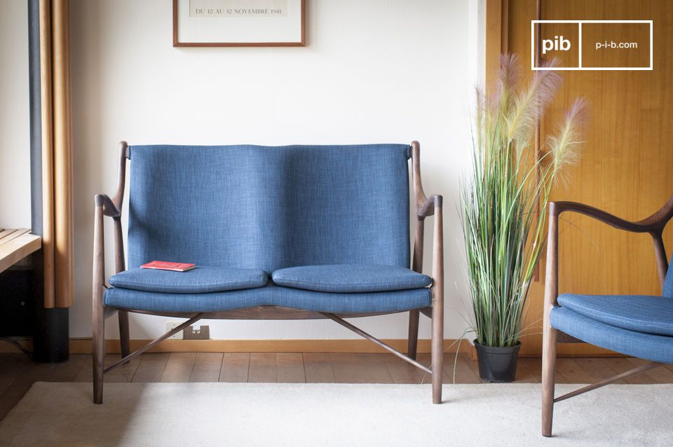 Two-seater armchair in a pretty blue colour combined with a wooden structure.