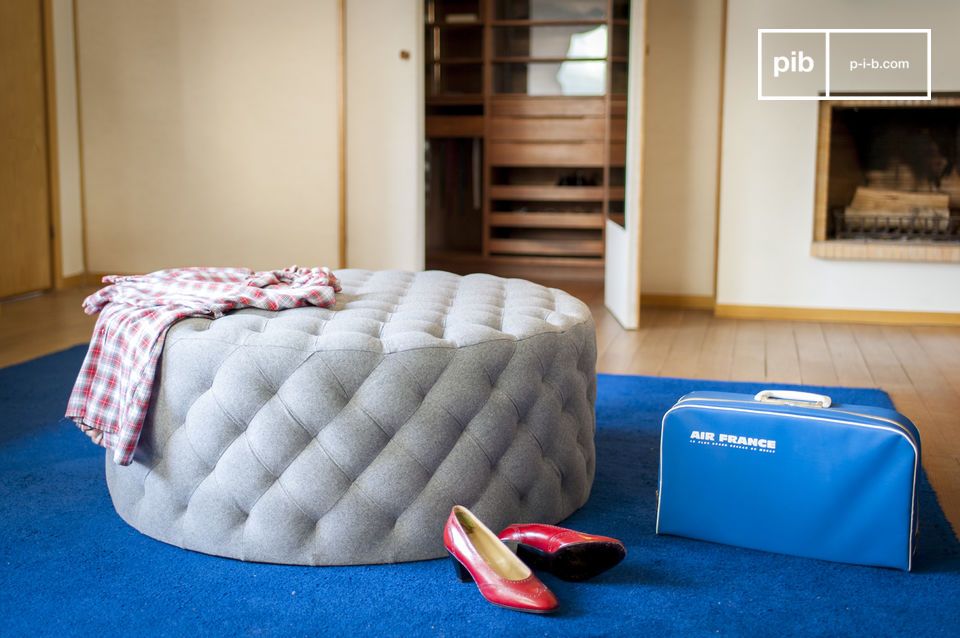 A XXL footstool that can be used as a side table.