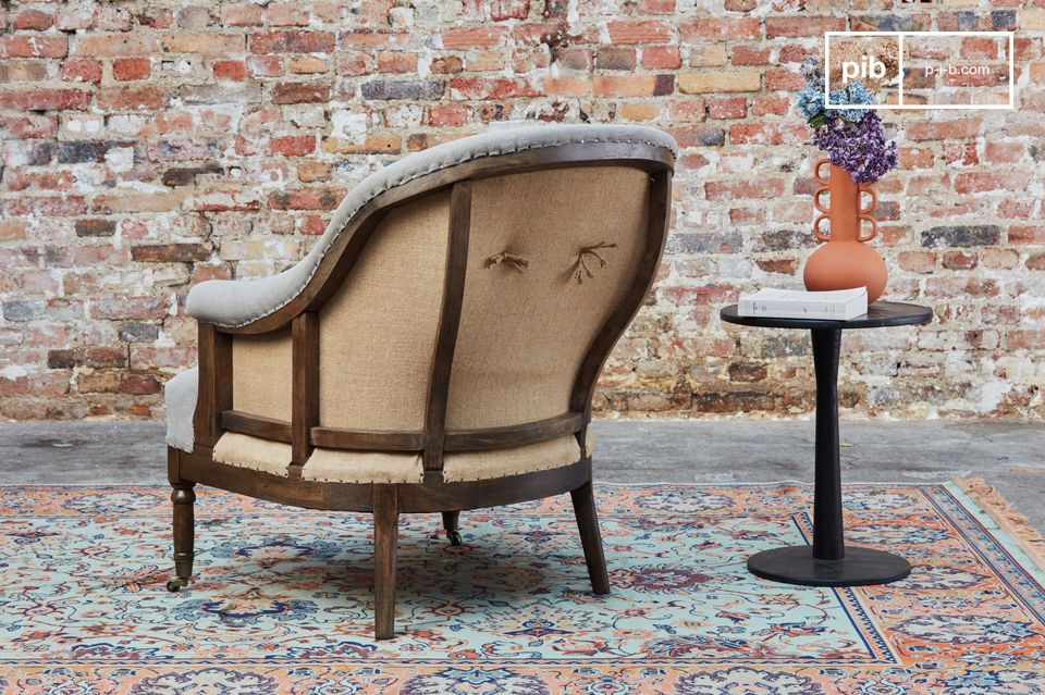 The Léonie round armchair is a beautiful armchair in grey fabric that will bring a bohemian country