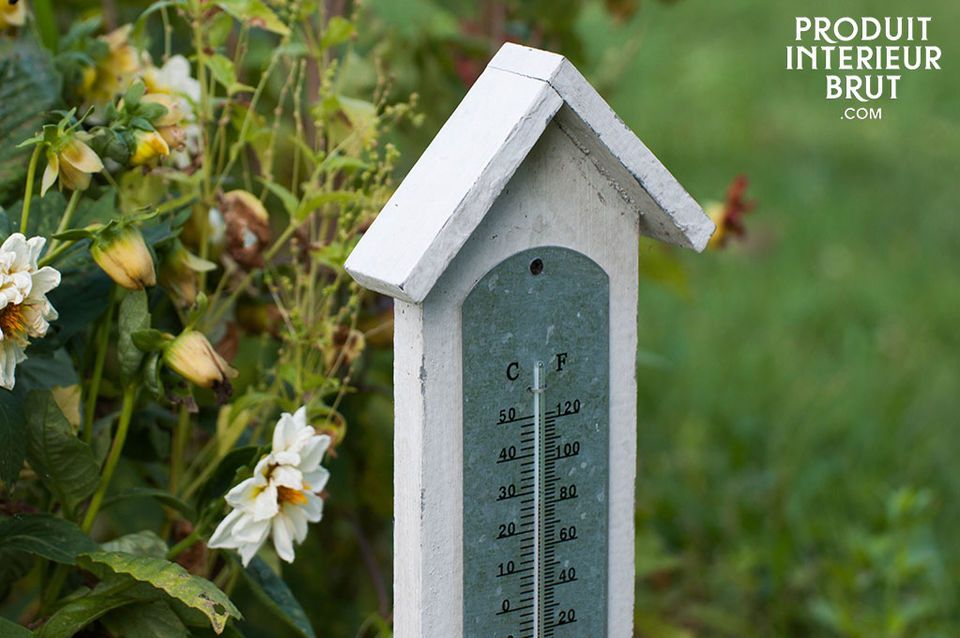 A charming outdoor thermometer with a base