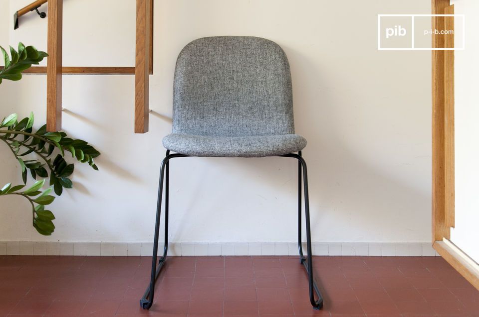 Light grey armchair with a black metal structure.