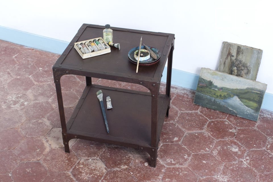 Rust-finish side table with two trays.
