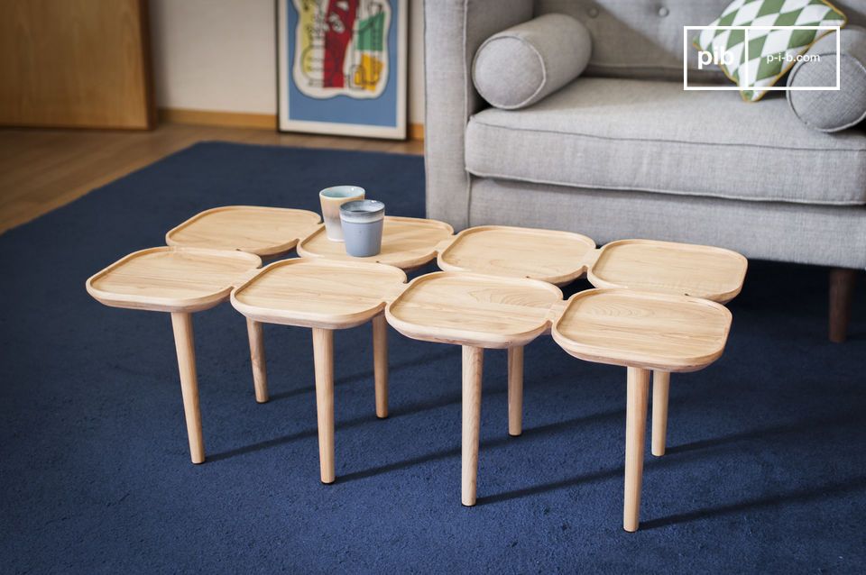 Original light wood coffee table with an assembly of trays.