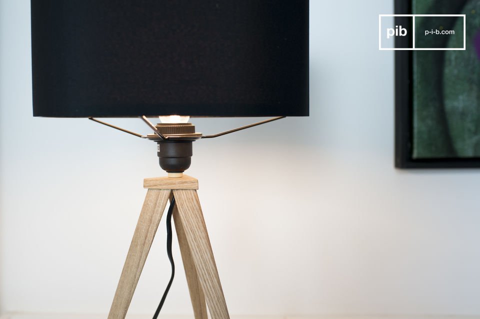 Pretty black lampshade that goes well with the wood of the base.