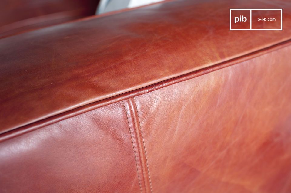 Pretty coral tone of the leather which gives a soft warmth to the sofa.