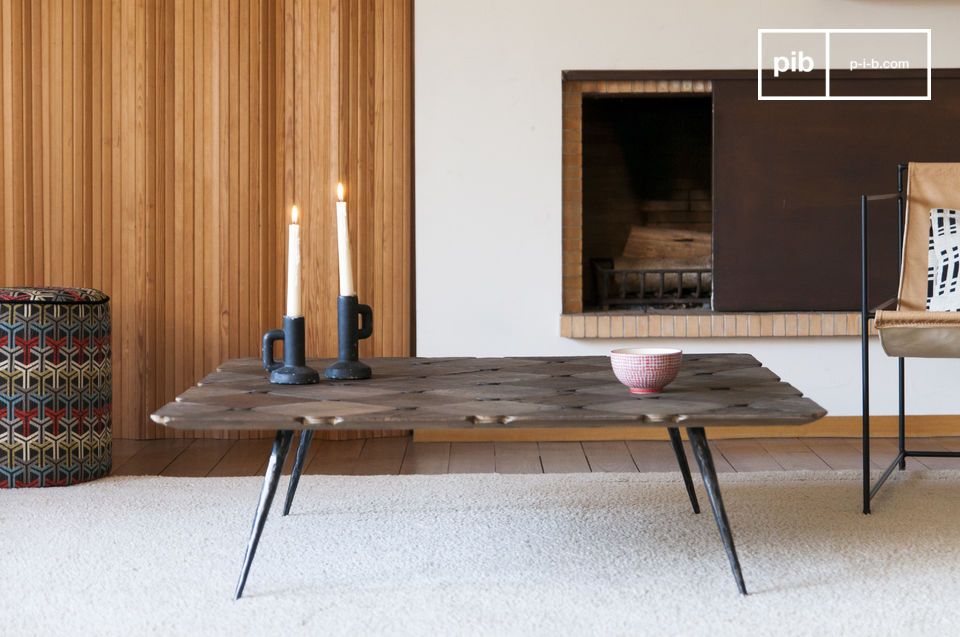 Large coffee table with slanted legs reminiscent of chopsticks.