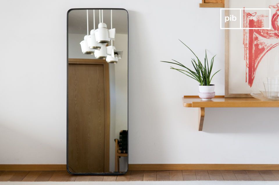 Large rectangular mirror with a metallic black frame and rounded corners.