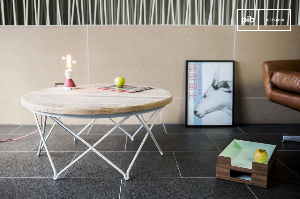 Beautiful round table in light wood with a white metal base.