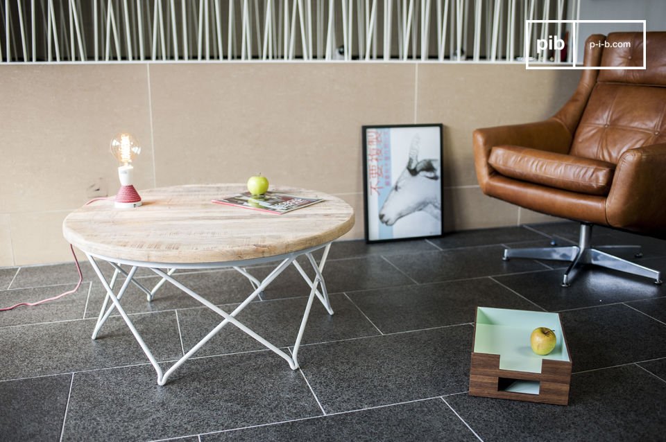 Beautiful round table in light wood with a white metal base.