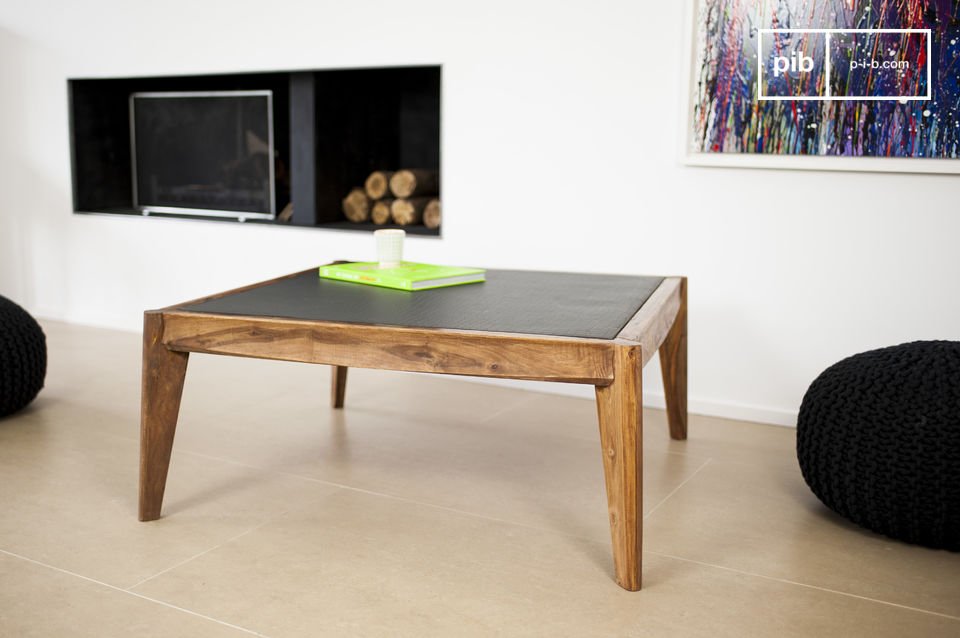 A beautiful coffee table in wood and imitation leather.