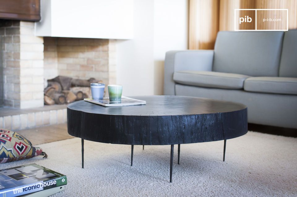 Thick black wooden table with thin metal legs.